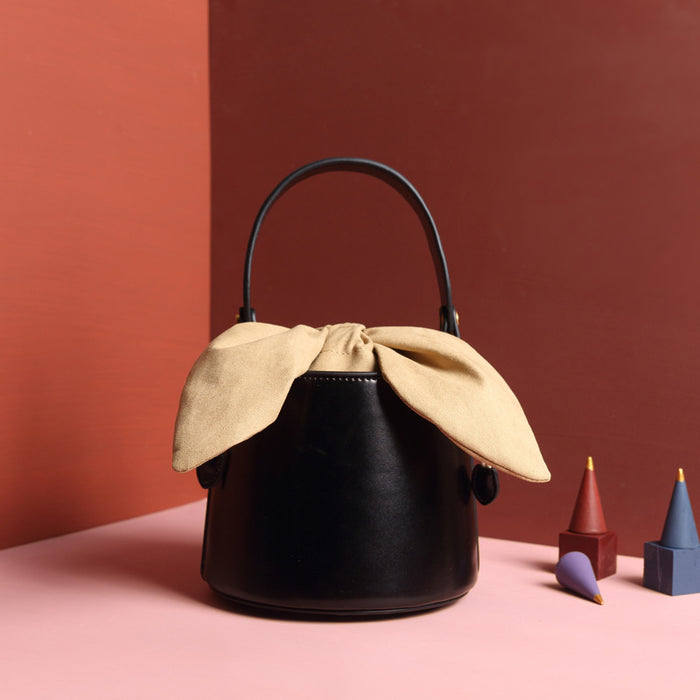 Leather bow bucket bag